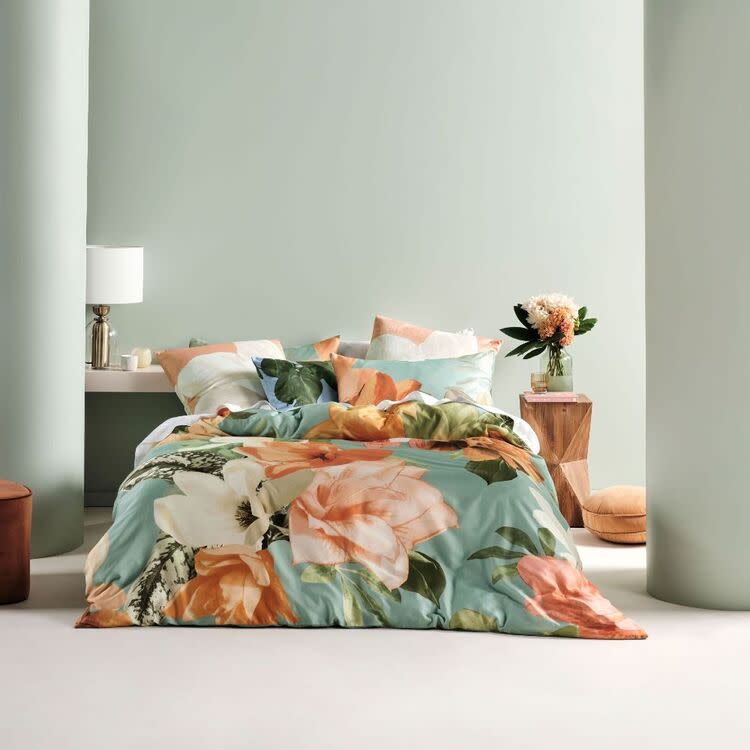Pic of large bold floral in green, cream and apricot. Linen House Shakira Cotton Quilt Cover, $195.95,