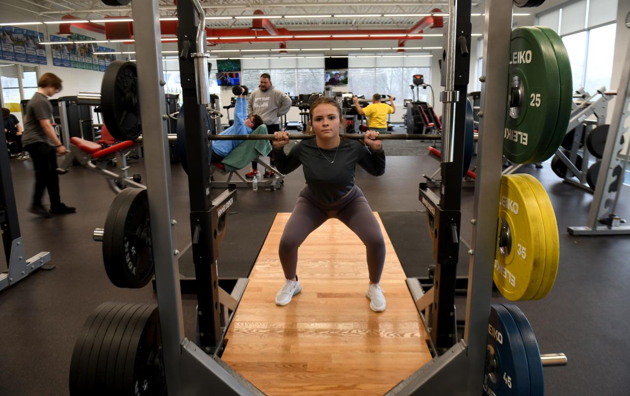 Lacy Hall, 17, from Manchester takes time for fitness at the Schalmo Family YMCA in Canal Fulton.