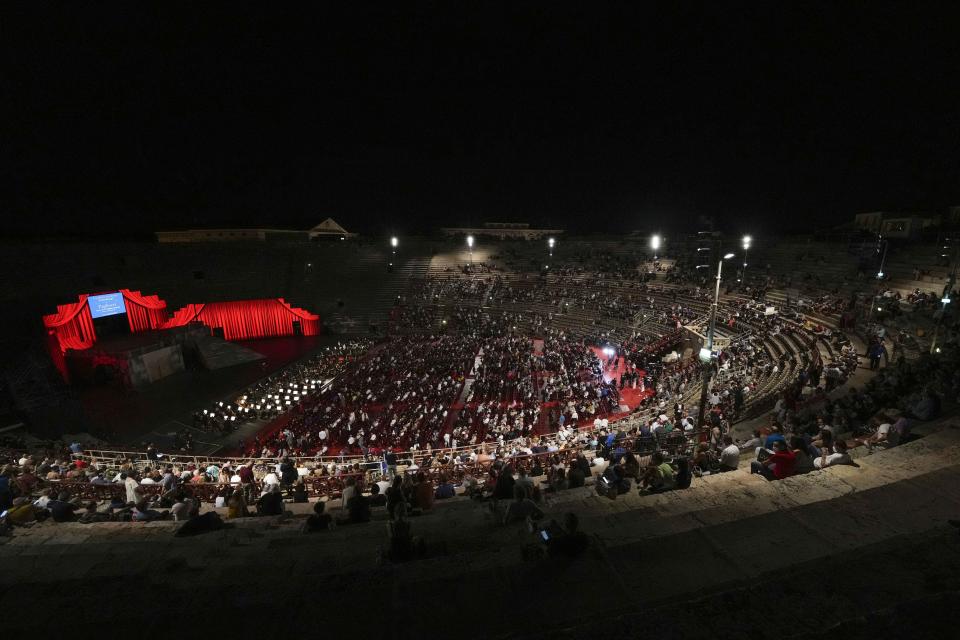 A view of the stage during 'I Pagliacci' (The Clowns) lyric opera, at the Arena di Verona theatre, in Verona, Italy, Friday, June 25, 2021. The Verona Arena amphitheater returns to staging full operas for the first time since the pandemic struck but with one big difference. Gone are the monumental sets that project the scene to even nosebleed seats in the Roman-era amphitheater, replaced by huge LED screens with dynamic, 3D sets that are bringing new technological experiences to the opera world. (AP Photo/Luca Bruno)
