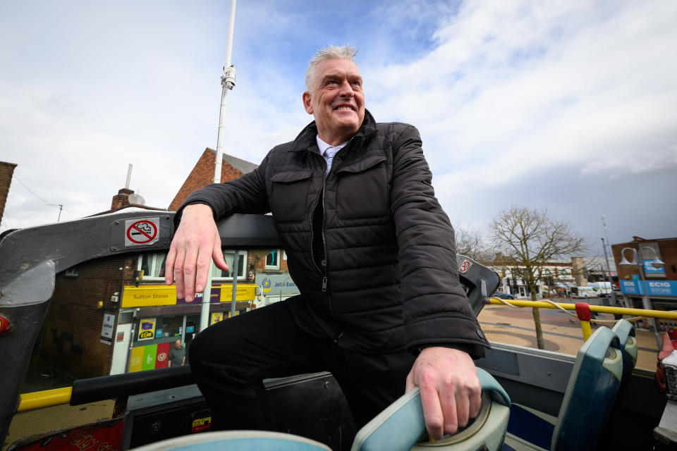 KIRKBY IN ASHFIELD, ENGLAND - MARCH 15: Reform Party MP Lee Anderson sits on the top of an open-top bus during a party campaign visit on March 15, 2024 in Sutton in Ashfield, England. Reform UK Party Leader Richard Tice joined former Tory deputy chairman Lee Anderson MP for his first full day in his constituency since Anderson announced his defection to Reform UK on Monday. (Photo by Leon Neal/Getty Images)