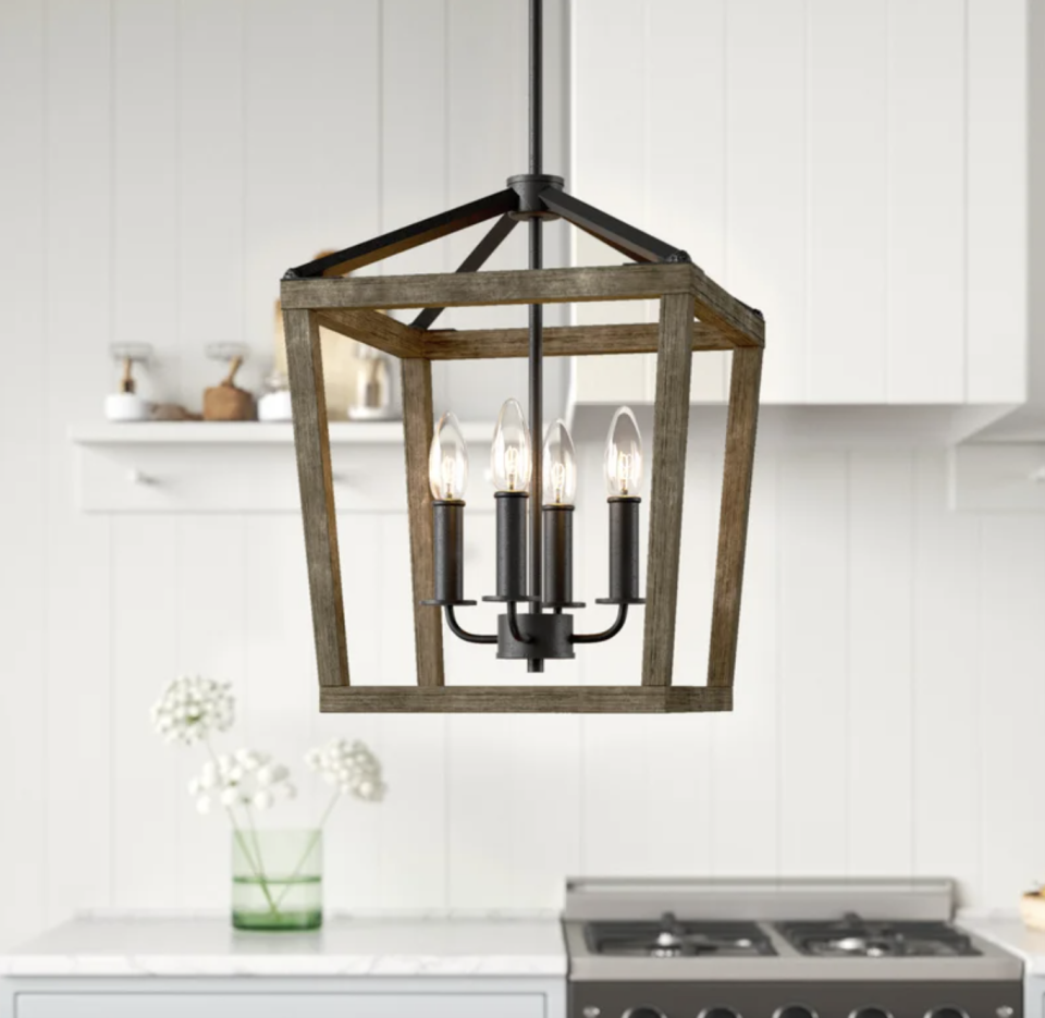 4 - Light Lantern Geometric Chandelier against white kitchen background (Photo via Wayfair)
