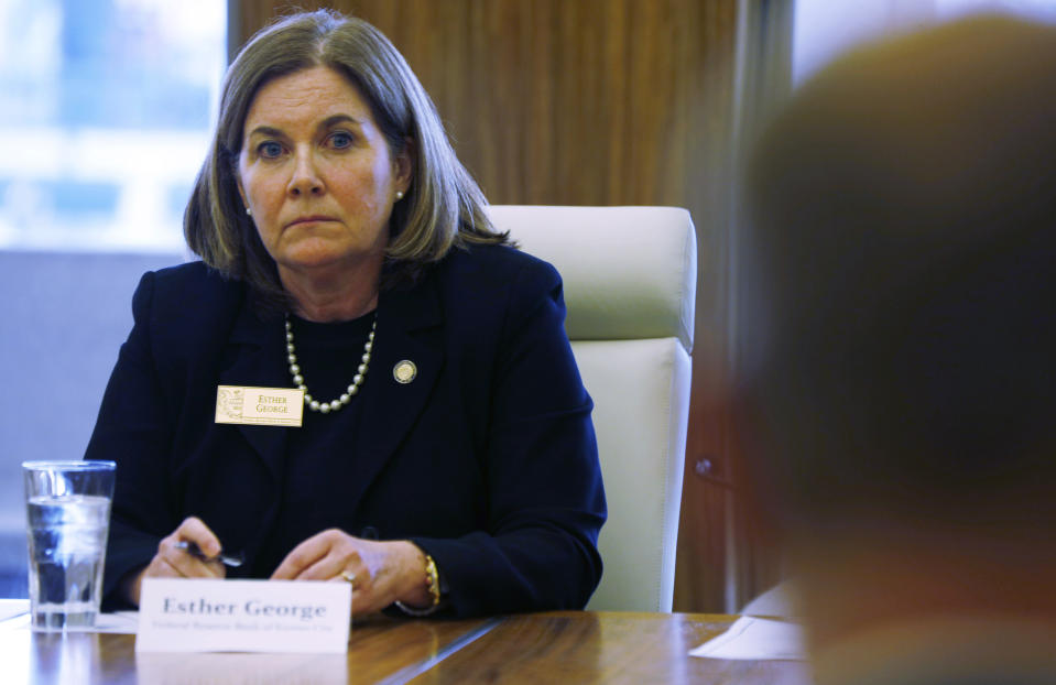 Esther George, left, president of the Kansas City Federal Reserve Bank, listens to a speaker during a closed door meeting with representatives of the marijuana industry in Colorado, Thursday, April 9, 2015, in Denver. Kansas City Federal Reserve President George held the closed door meeting with 20 representatives of the marijuana industry at the behest of Colorado congressmen Ed Perlmutter and Jared Polis. (AP Photo/David Zalubowski)