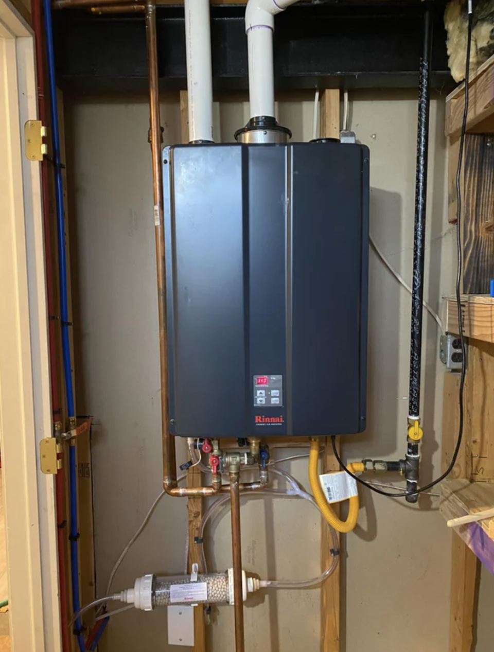 Installed tankless water heater in a home utility area