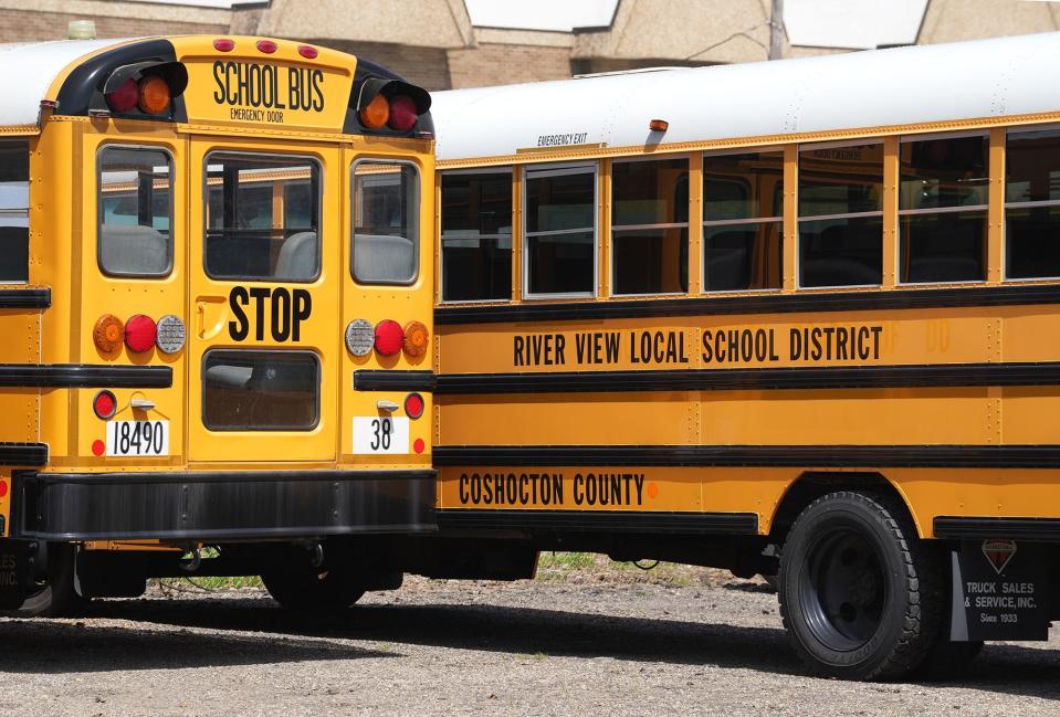 June 16, 2022; Warsaw, Ohio; School buses for the River View Local School District in Coshocton County parked near the district administration office. Fred Squillante- The Columbus Dispatch