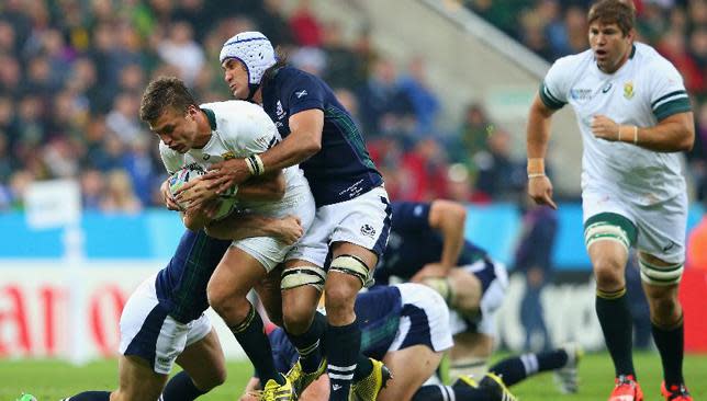 Scotland's Blair Cowan tackles Handre Pollard.