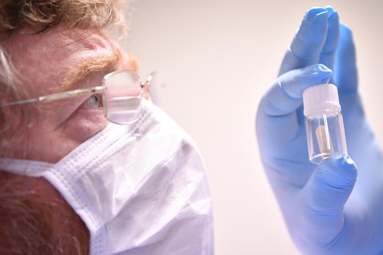 Chief Scientific Officer Dr Jeff Drew, holds samples of the potential oral vaccine for the COVID-19 illness that are being tested for temperature stability in the Stabilitech laboratory in Burgess Hill south east England, on May 15, 2020. - The scientists at Stabilitech are one of the teams attempting to develop a vaccine for COVID-19. Ingested in a capsule into the gut, Stabilitech's potential oral vaccine aims to prompt an immune response in mucosal cells in the respiratory system and elsewhere in the body. The firm believes that will be more effective in tackling respiratory illnesses like coronavirus. The British government is touting the country as a global leader in the big-money investment race to find a vaccine for COVID-19. (Photo by BEN STANSALL / AFP) / TO GO WITH AFP STORY BY JOE JACKSON (Photo by BEN STANSALL/AFP via Getty Images)