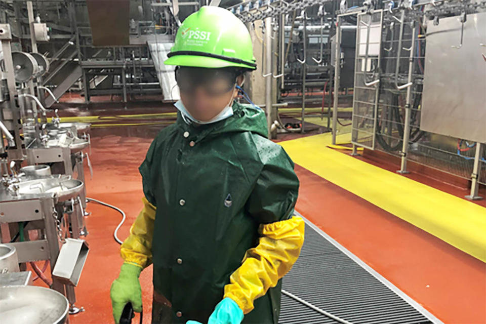 Photo taken by Department of Labor investigator of a child who worked for Packers Sanitation Services Inc. (PSSI).
cleaning a slaughterhouse in Grand Island, Nebraska. (U.S. Department of Labor)