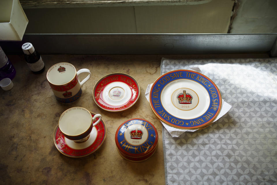 Finished pieces of pottery on display, at the Duchess China 1888 factory, in Stoke-on-Trent, England, Thursday, March 30, 2023. With just five weeks to go until King Charles III’s coronation, an historic pottery is busy producing “God Save The King” commemorative china plates and mugs to mark the occasion. (AP Photo/Jon Super)