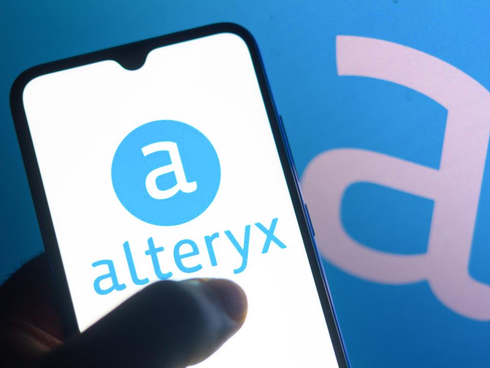 In this photo illustration, the Alteryx logo seen displayed on a smartphone.