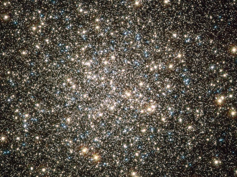 messier 13 star cluster hundreds of stars bright yellow pink blue