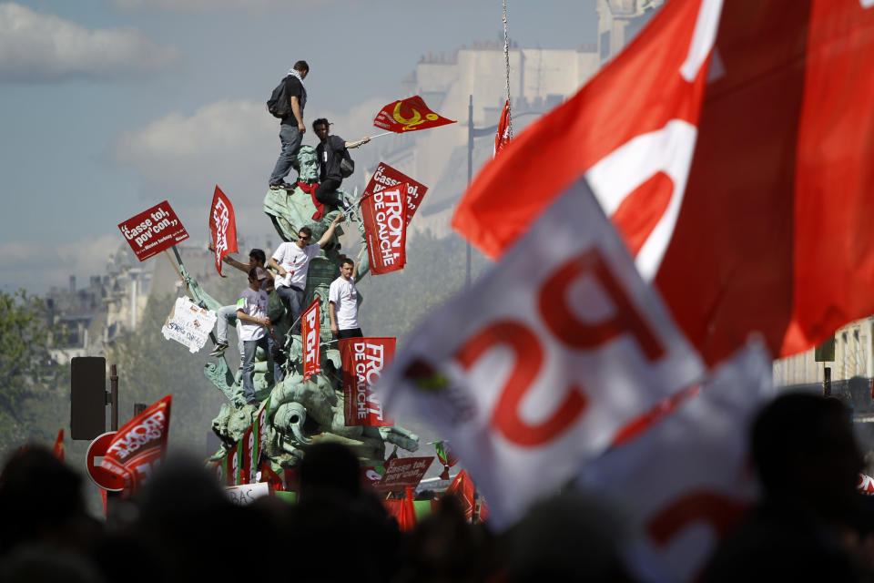 People demonstrate in Paris, France, during the traditional May Day march, Tuesday, May 1, 2012. Tens of thousands of workers, leftists and union leaders around France are marking May Day with marches and rallies, in an ambiance of optimism ahead of presidential elections Sunday that a Socialist is expected to win. (AP Photo/Laurent Cipriani)