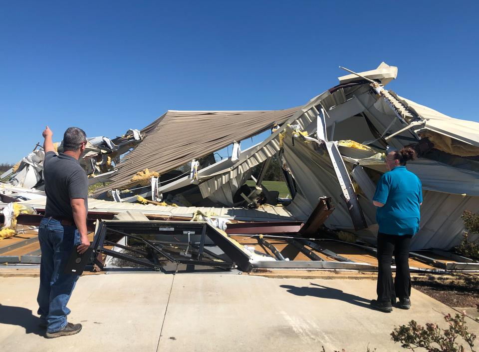 National weather service forecasters survey the damage at the North Campus of First Baptist Church of Selmer in Selmer, Tenn., on Saturday, April 1, 2023.