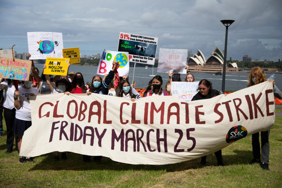 Climate protesters gather in front of Sydney Harbour