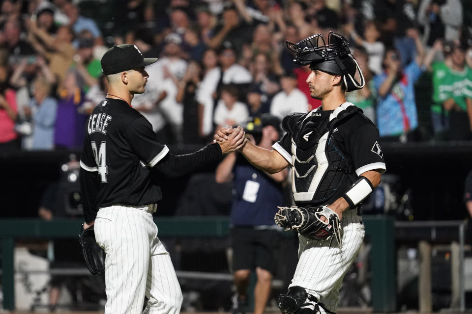Chicago White Sox starting pitcher Dylan Cease, left, celebrates with catcher Seby Zavala after they defeated the Minnesota Twins in a baseball game in Chicago, Saturday, Sept. 3, 2022. (AP Photo/Nam Y. Huh)