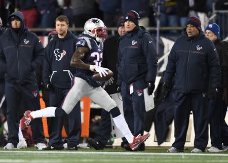 Jan 14, 2017; Foxborough, MA, USA; New England Patriots free safety Devin McCourty (32) intercepts a pass against the Houston Texans during the third quarter in the AFC Divisional playoff game at Gillette Stadium. Mandatory Credit: James Lang-USA TODAY Sports