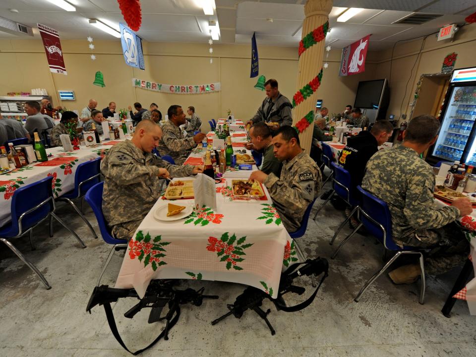 US soldiers eat lunch on Christmas day at a military camp in Nuristan Province on December 25, 2009.