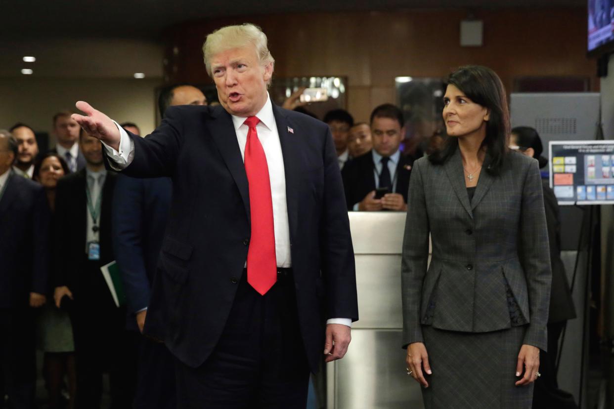 President Trump, accompanied by U.S. Ambassador Nikki Haley, arrives at the United Nations, Monday, Sept. 18, 2017.