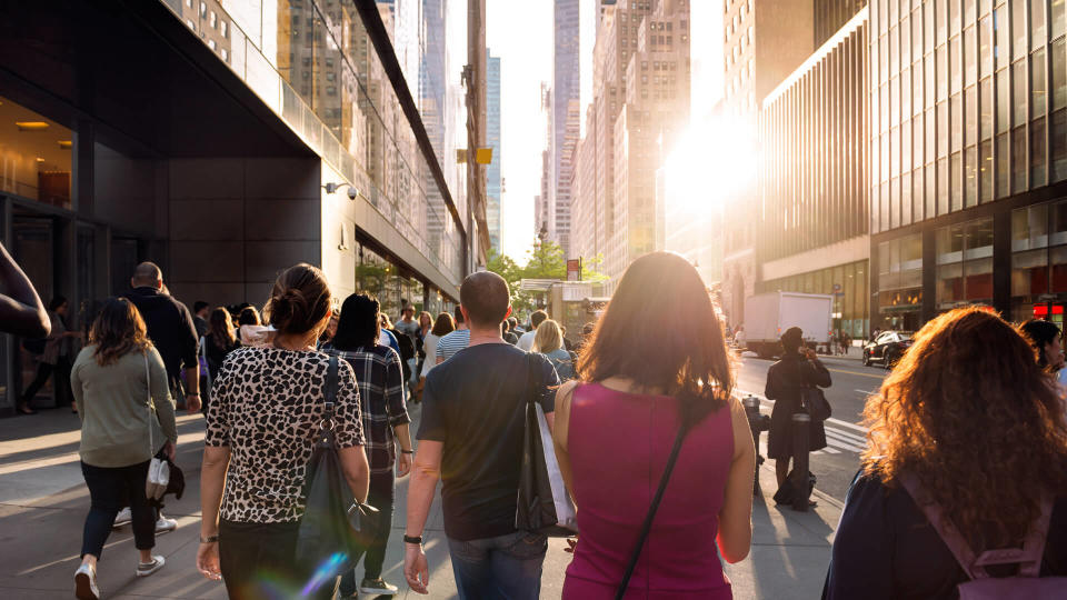 people in New York walking home from work