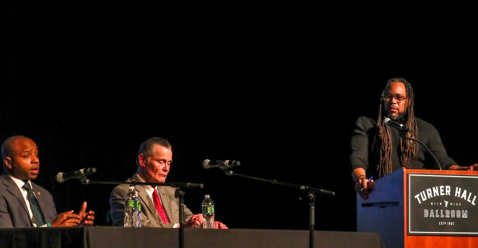 Acting Mayor Cavalier Johnson and mayoral candidate Bob Donovan discuss public safety and gun violence while Milwaukee Journal Sentinel columnist James Causey moderates during the Tussle at Turner Milwaukee Mayoral Candidate forum Wednesday, March 16, 2022, at Turner Hall in Milwaukee.