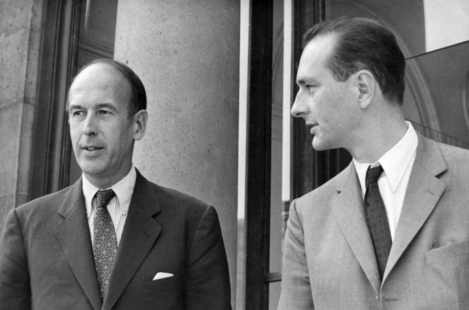 FILE - In this Aug.9 1969, Valery Giscard d'Estaing, left, as Finance Minister and Jacques Chirac as Secretary of State to Finance leave Elysee Palace, Aug. 9, 1969. Valery Giscard d’Estaing, the president of France from 1974 to 1981 who became a champion of European integration, has died Wednesday, Dec. 2, 2020 at the age of 94, his office and the French presidency said. (AP Photo, File)