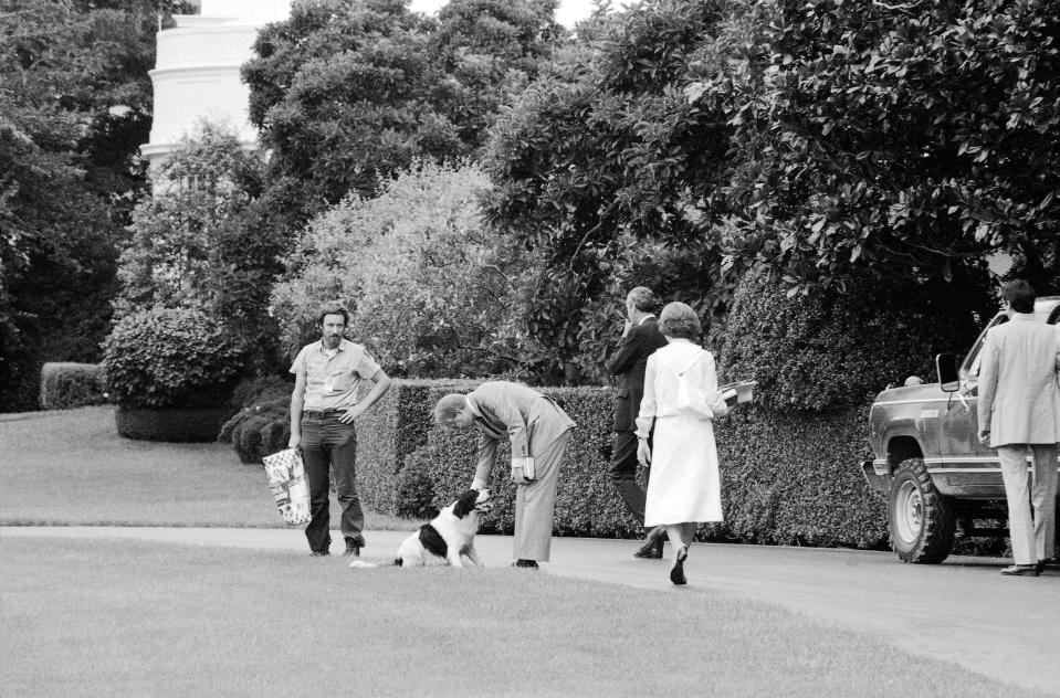 President Jimmy Carter and Rosalynn Carter play with their dog Grits in 1978.