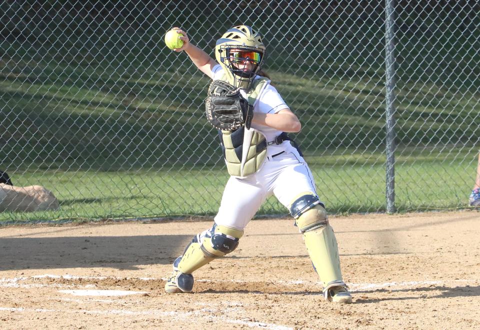 Essex catcher Avery Casavant attempts to pick off a runner at first during the Hornets 3-0 loss to Enosburg in 2023.