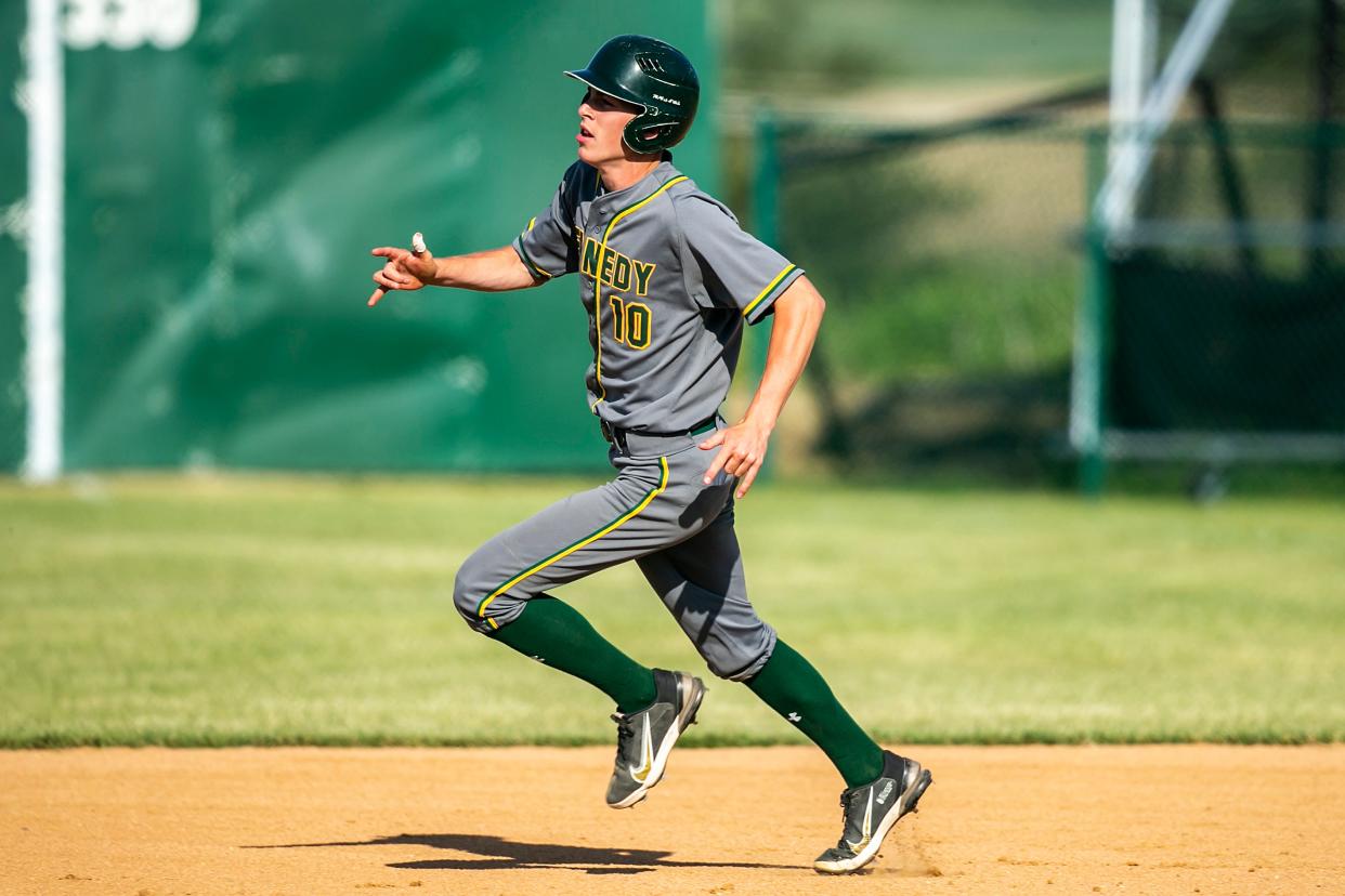 Cedar Rapids Kennedy's Nolan Grawe rounds first base during a high school baseball game against Western Dubuque, Tuesday, May 30, 2023, at Farley Community Park in Farley, Iowa.