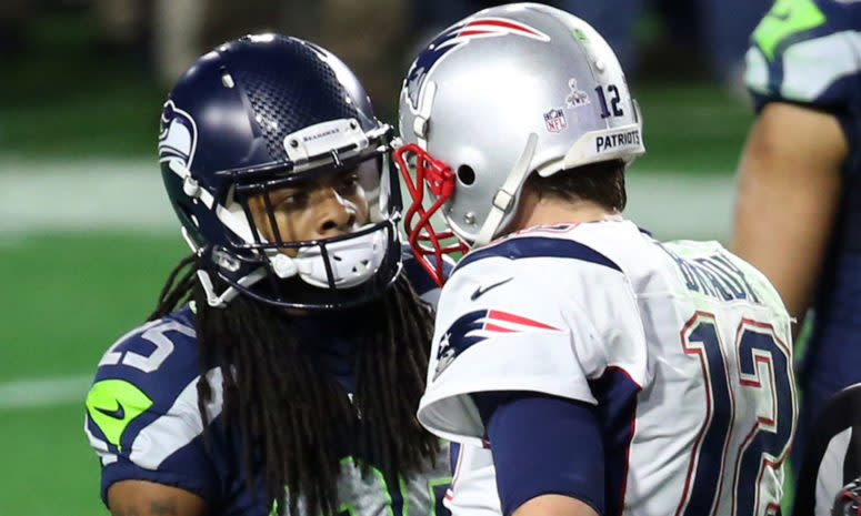 Richard Sherman speaks with Tom Brady at the end of Super Bowl XLIX.