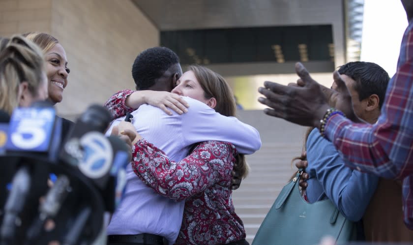 LOS ANGELES, CA - JULY 27: Assistant U.S. Atty. Lindsay Bailey hugs surviving victim Dane Brown following Ed Buck's guilty verdict on Tuesday, July 27, 2021 in Los Angeles, CA. (Myung J. Chun / Los Angeles Times)