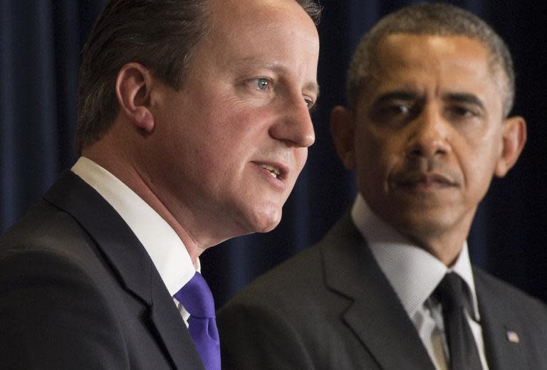 British Prime Minister David Cameron (L) and US President Barack Obama hold a joint press conference during the G7 Summit at the European Council in Brussels, on June 5, 2014