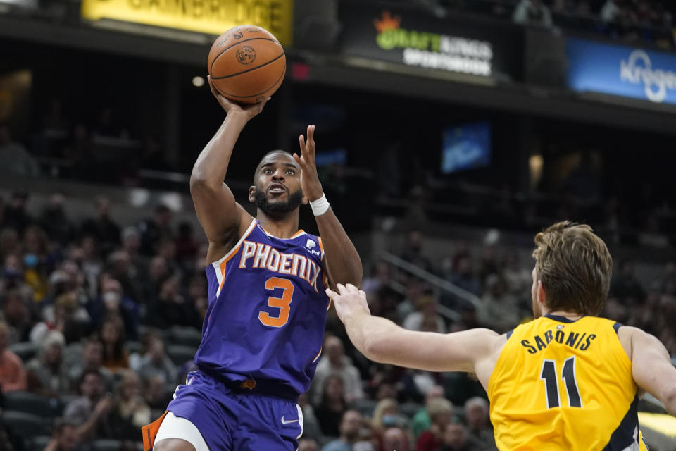 Phoenix Suns' Chris Paul (3) shoots against Indiana Pacers' Domantas Sabonis (11) during the second half of an NBA basketball game, Friday, Jan. 14, 2022, in Indianapolis. (AP Photo/Darron Cummings)