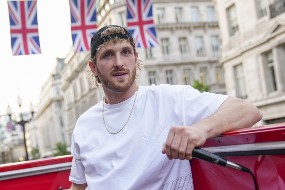 FILE - Logan Paul promotes an energy drink on an open top bus traveling through London, Friday, June 17, 2022. Logan Paul has 25 1/2 million Instagram followers and a spot in WWE's main event on Saturday's card in Saudi Arabia. (AP Photo/Scott Garfitt, File)