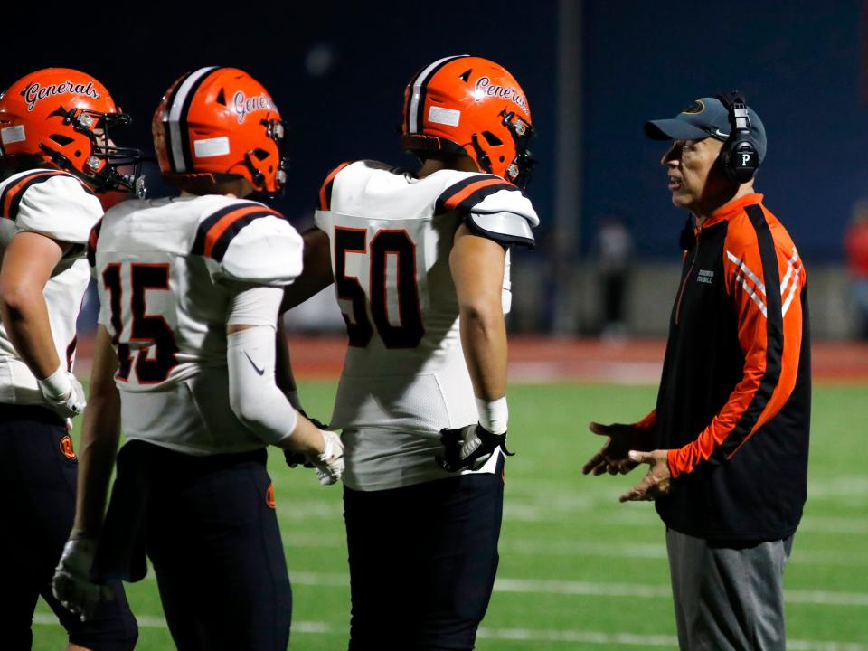 Ridgewood head coach John Slusser talks to his defense after a third-quarter touchdown against Indian Valley in a 35-12 loss earlier this season. The veteran coach's leadership has been vital to the Generals' success this season.