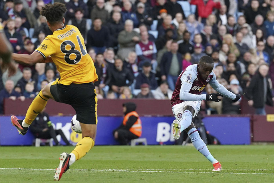 Aston Villa's Moussa Diaby, right, scores the opening goal during the English Premier League soccer match between Aston Villa and Wolverhampton Wanderers in Birmingham, England, Saturday, March 30, 2024. (Nick Potts/PA via AP)