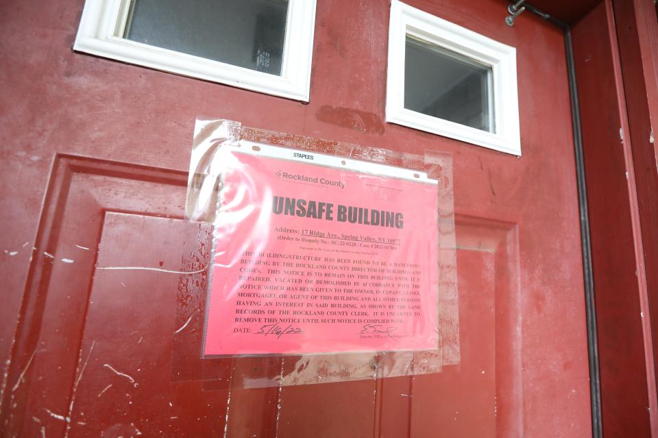 Warning notice on a door at 17 Ridge Ave., in Spring Valley May 19, 2022. The apartment building has been declared unsafe because of violations of fire and safety codes.