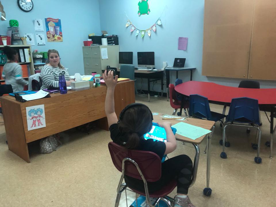 A student studies at Centennial School in Bethlehem, Pennsylvania, in April 2019, before the coronavirus pandemic shut down schools. The light are colored blue for the comfort of children with sensory disorders.