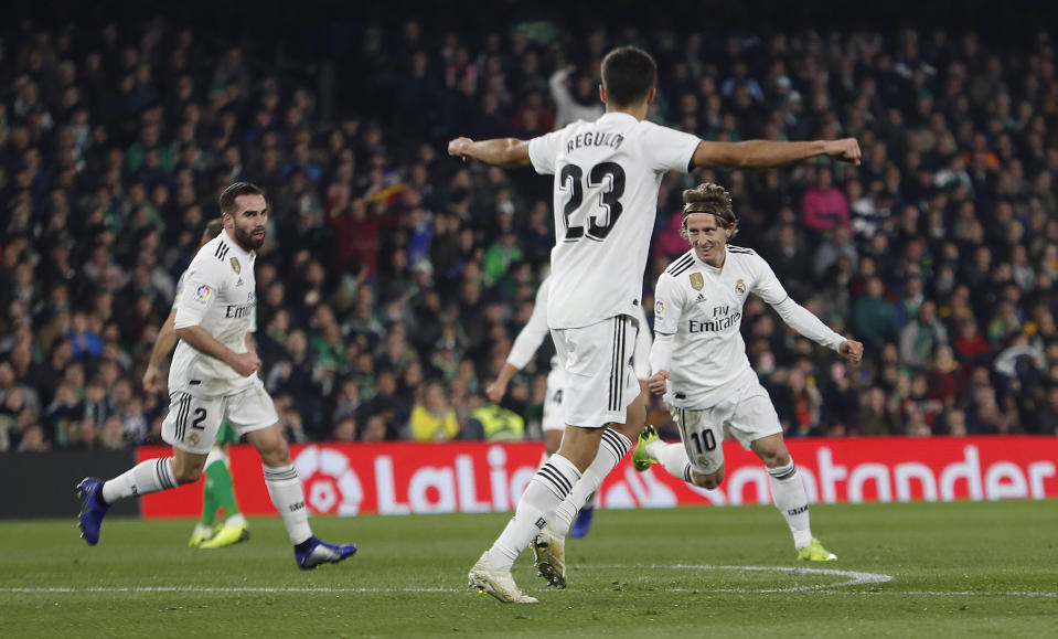 Real Madrid's Modric, right, celebrates after scoring against Betis during La Liga soccer match between Betis and Real Madrid at the Villamarin stadium in Seville, Spain, Sunday, January 13, 2019. (AP Photo/Miguel Morenatti)