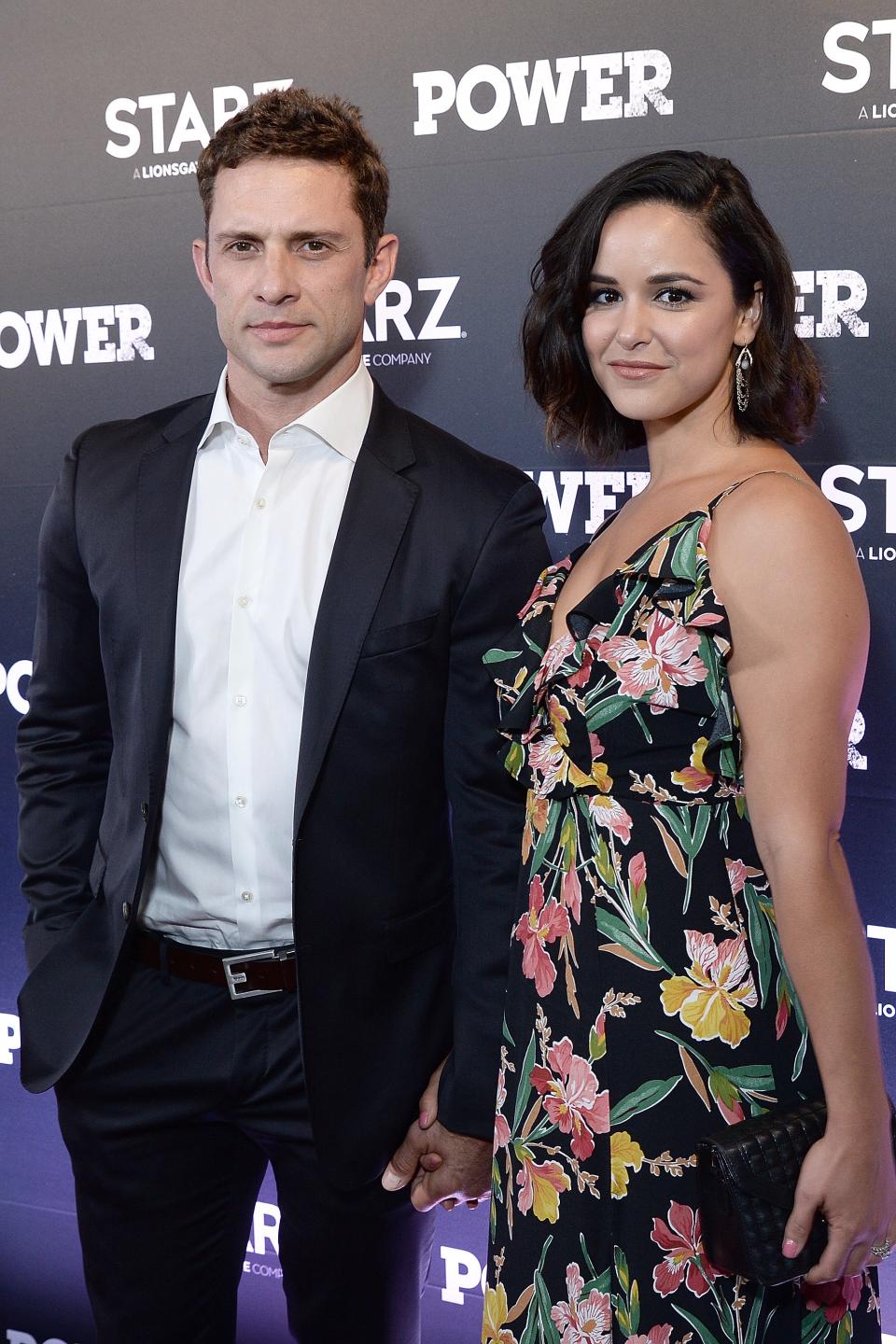 David Fumero in a suit and Melissa Fumero in a floral dress at the Starz 'Power' event