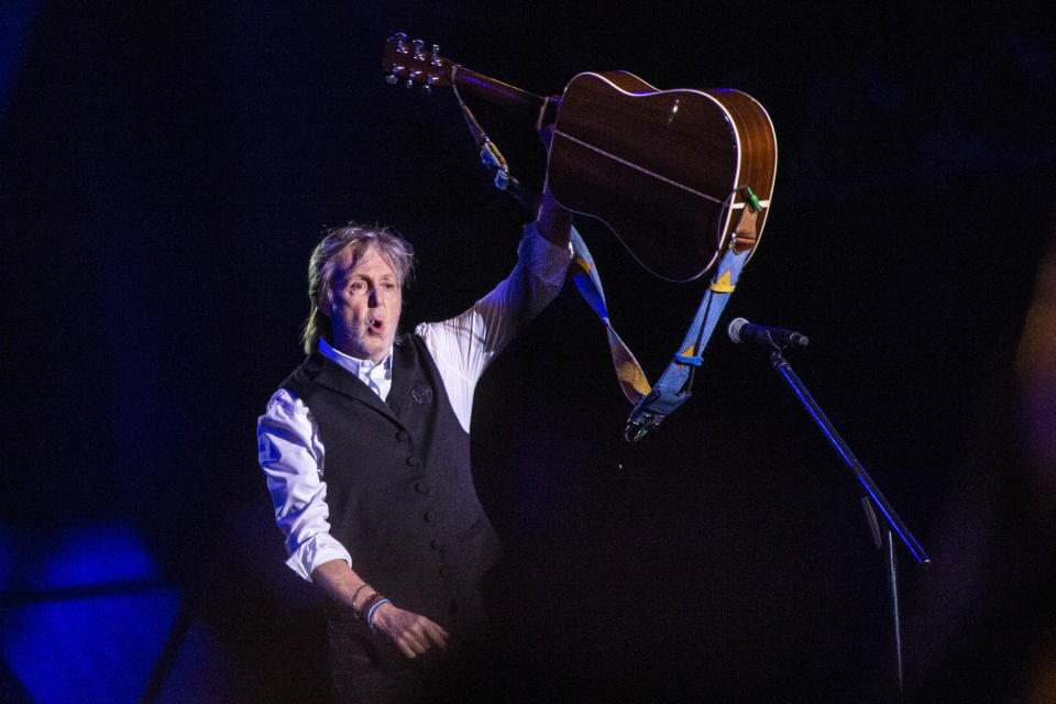 FILE - Paul McCartney performs at Glastonbury Festival in Worthy Farm, Somerset, England, on June 25, 2022. With an assist from Paul McCartney, the Paralympic Games starts its 100-day race Monday to the opening ceremony in Paris in August. (Joel C Ryan/Invision/AP, File)