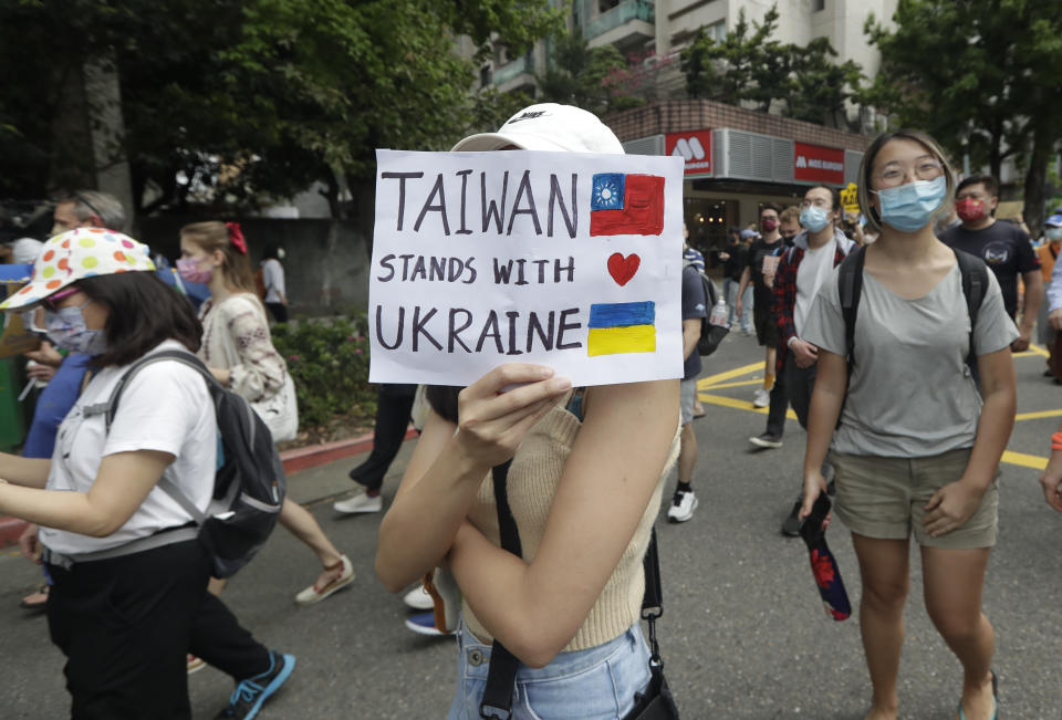 Ukrainian nationals in Taiwan and supporters protest against the invasion of Russia during a march in Taipei, Taiwan, Sunday, March 13, 2022. (AP Photo/Chiang Ying-ying)