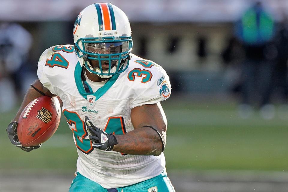 Miami Dolphins running back Ricky Williams #34 during the NFL regular season game between the Miami Dolphins and the Oakland Raiders at Oakland Coliseum in Oakland, CA.