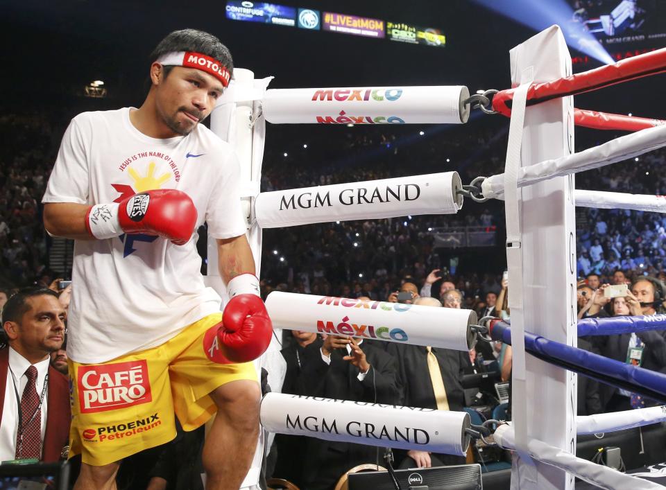 Manny Pacquiao of the Philippines arrives in the ring to face Floyd Mayweather Jr. of the U.S. ahead of their welterweight WBO, WBC and WBA (Super) title fight in Las Vegas, Nevada, May 2, 2015. REUTERS/Steve Marcus