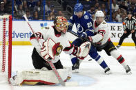 Ottawa Senators goaltender Anton Forsberg (31) deflects the puck as defenseman Erik Brannstrom (26) keeps Tampa Bay Lightning center Michael Eyssimont (23) from a rebound during the second period of an NHL hockey game Thursday, April 11, 2024, in Tampa, Fla. (AP Photo/Chris O'Meara)