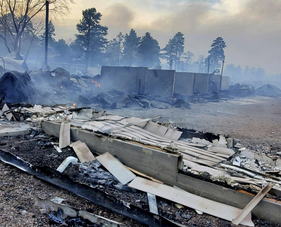 This Wednesday April 20, 2022, photo provided by Bill Wells shows his home on the outskirts of Flagstaff, Ariz., destroyed by a wildfire on Tuesday, April 19, 2022. The wind-whipped wildfire has forced the evacuation of hundreds of homes and animals. (Bill Wells via AP)