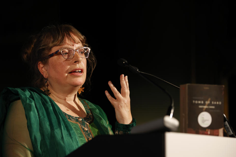 Translator Daisy Rockwell gives her acceptance speech after winning the 2022 International Booker Prize for her translation of Geetanjali Shree's 'Tomb of Sand' in London, Thursday, May 26, 2022. (AP Photo/David Cliff)