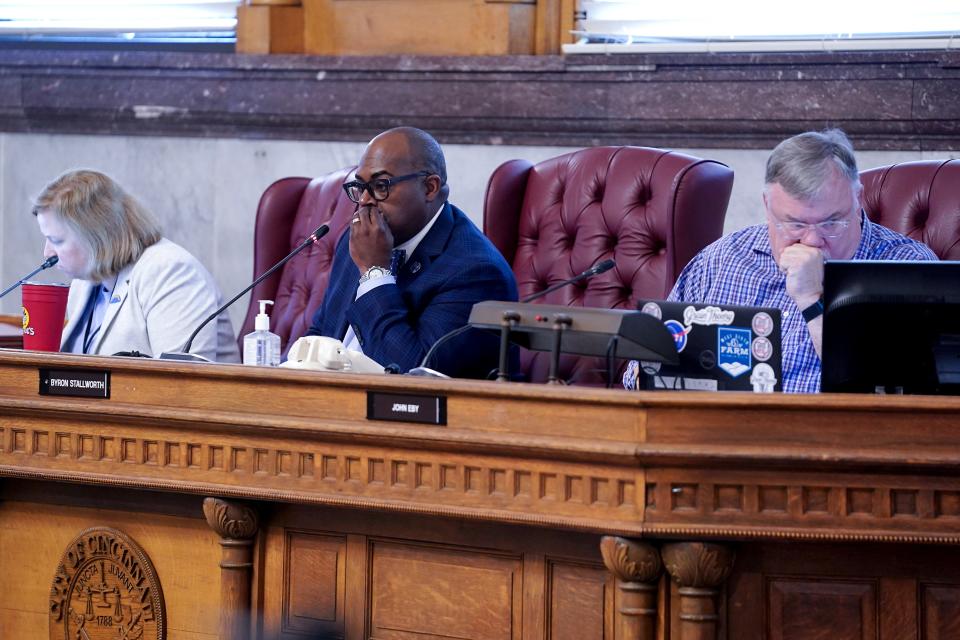 From left: Cincinnati Planning Director Katherine Keough-Jurs, Cincinnati Planning Commission Chair Byron Stallworth and commission member John Eby listen to public comment before a vote on a zoning overhaul named Connected Communities, Friday, May 17, 2024, at City Hall in Cincinnati.