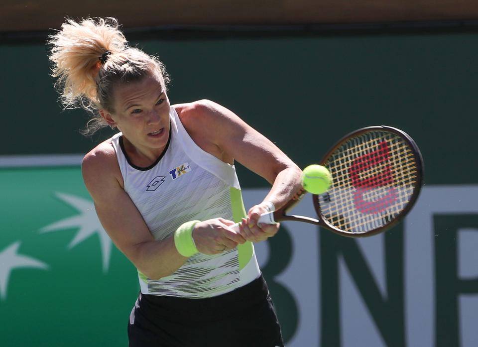 Katerina Siniakova hits a shot in the doubles finals match against Beatriz Hadda Maia and Laura Siegemund during the BNP Paribas Open at the Indian Wells Tennis Garden in Indian Wells, Calif., March 18, 2023.