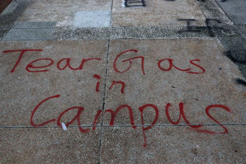 A message is written in graffiti on the campus of the Hong Kong Polytechnic University (PolyU) in Hong Kong