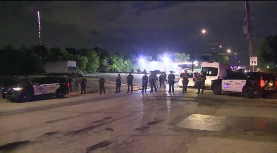 Police arrive on the scene of a deadly shooting late Monday, July 3, 2023 in Forth Worth, Texas. Authorities say gunfire erupted following a local festival in the Como neighborhood in the city's southwest. (WFAA via AP)