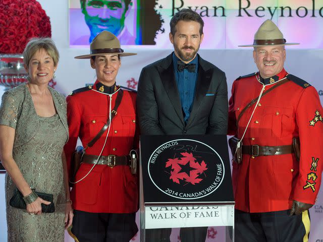 <p>Rick Madonik/Toronto Star/Getty</p> Ryan Reynolds with his mom Tammy Reynolds on Canada's Walk of Fame in 2014